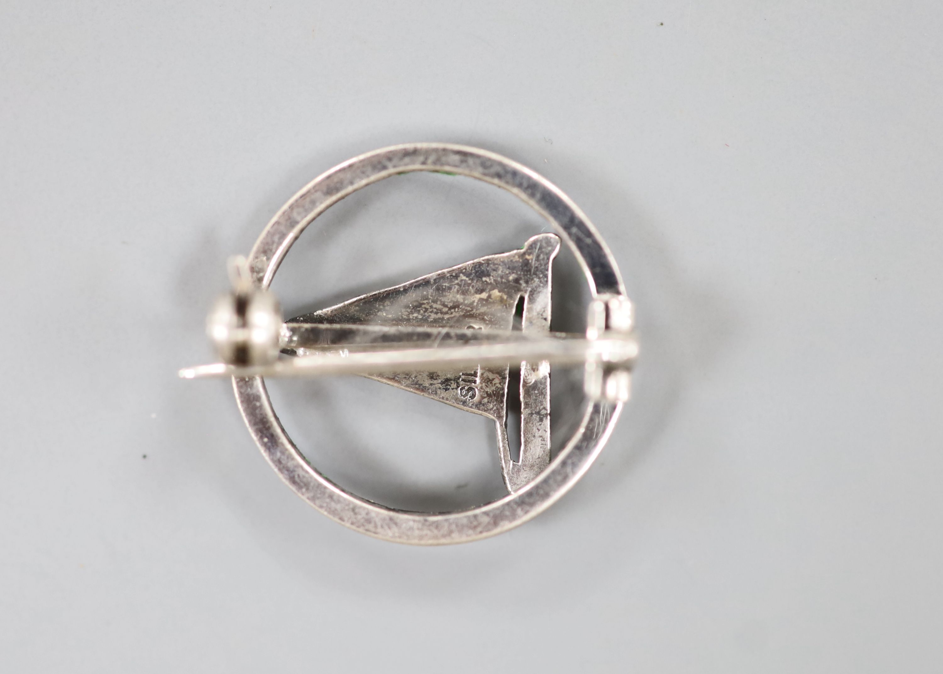 A white metal (stamped silver) and polychrome enamel yachting brooch, 20mm.